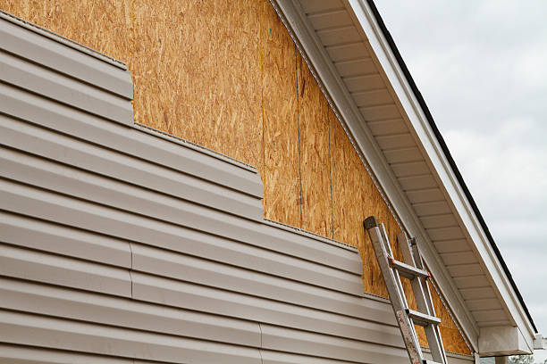 Professional Siding Installation technician working in Crownsville, MD